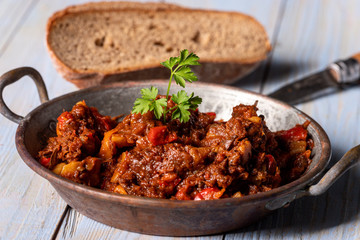 portion of austrian goulash on wood