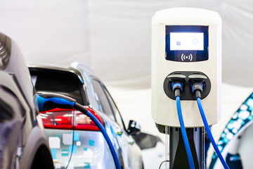 Modern electrical fast charger to electrical or hybrid PHEV automobiles. Future energy power....