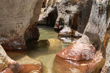 Hiking through red rocks and emerald pools