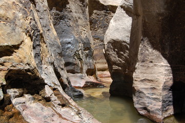 Hiking through red rocks and emerald pools