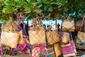 Wicker bags on sale in the local market, Tanna Island, Vanuatu. - obrazy, fototapety, plakaty