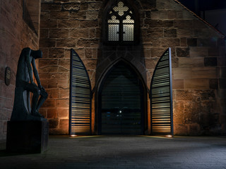 Church entrance illuminated in Nurnberg evening