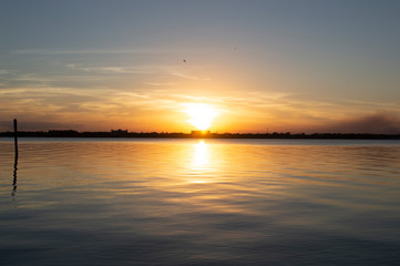 Fototapeta na wymiar Sunsets on Water