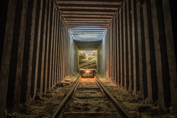 Empty mine cart (trollay) in tunnel.