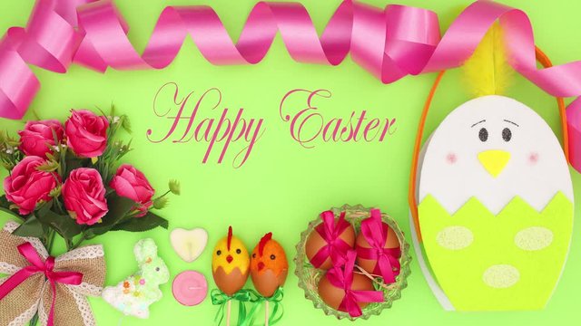Happy Easter title appear on green background with pastel Easter decoration - Stop motion 