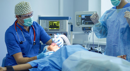 Man surgeon at work in operating room