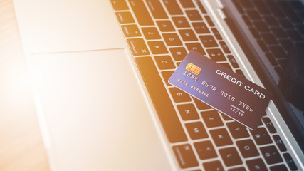 A close up of a credit card on a laptop