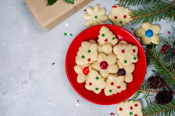 Homemade Christmas Spritz cookies on festive X'mas holiday frame