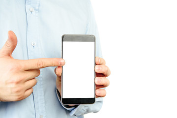 Phone in hand on a white background. A man holds a phone with a blank display in his hand. The concept of supplementing content, providing information.