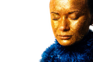 Gilt. Golden Woman's Face Closeup. Futuristic Gilded Make-up.