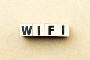 Letter block in word wifi on wood background