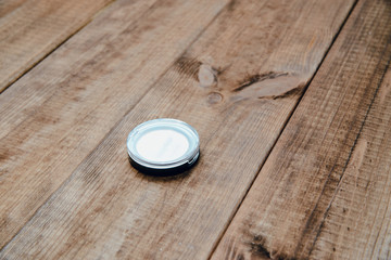 Eye shadow on a wooden table. The concept of doing makeup, caring for the appearance of women. Preparing women to leave.