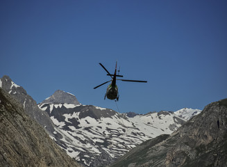 Fototapeta na wymiar Helicopter Transporting Goods to Mountain Site in the Nepal