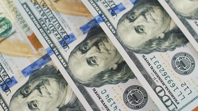 Close up of 100 usd money notes. Green dollars macro view. Background with money american bills. Cash money background. 4k footage. 