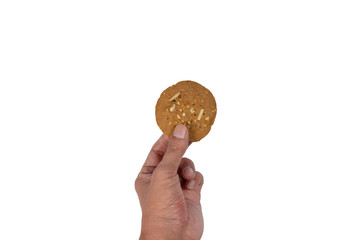 Hand holding Coffee cookie with almond isolated on white background.