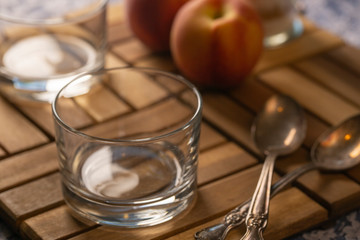 glass on table with peaches