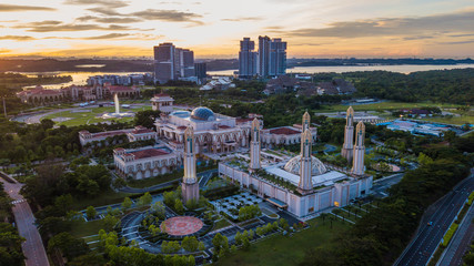 Naklejka na ściany i meble Beautiful aerial landscape during sunrise at The Kota Iskandar Mosque located at Kota Iskandar, Iskandar Puteri, Johor State Malaysia early in the morning