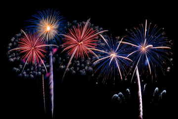 The colorful of fireworks showing on dark sky at night time for special celebration day with black background.