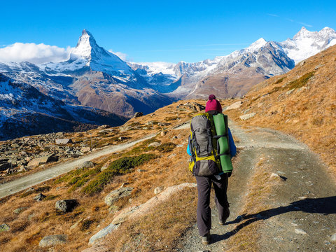 Matterhorn in early morning and trekker with outdoor equipment , Zermatt, Switzerland