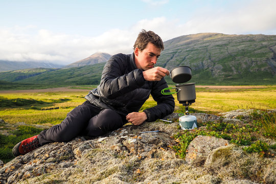 kettle boiling on a gas stove in the mountain camping