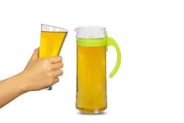Hand holding a glass of Beer with pitcher isolated on white background