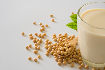 Soy milk and soy bean it on white table background,healthy concept. Benefits of Soy.