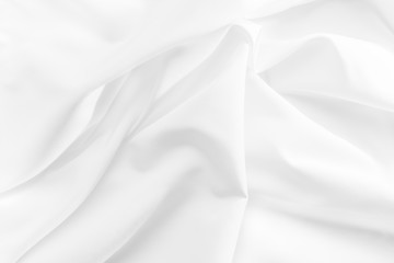 Abstract white fabric texture background. Cloth soft wave. Creases of satin, silk, and cotton.	