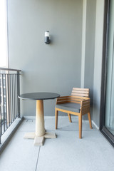 wood chair and table on balcony