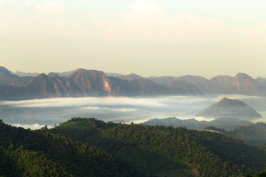 Beautiful landscape nature with mist and mountain at  Monkcrubasai view point in Mae Moei National Park in Tak province, Thailand      