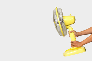 Electric Yellow table fan isolated on white background