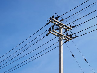 High voltage cable on the pole On the blue sky background With copy space