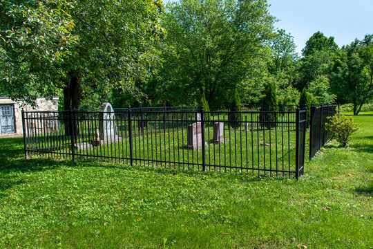 A graveyard in Virginia which has the burial places of local veterans. Photo taken in horizontal, landscape orientation.
