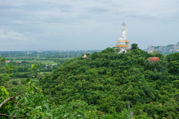 Fototapeta na wymiar Buddha on green mountain Thailand