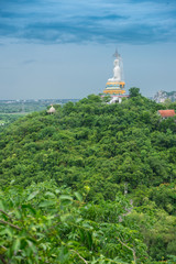 Fototapeta na wymiar Buddha on green mountain Thailand