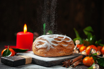 Apple strudel with tangerines and cinnamon sprinkled with sugar powder