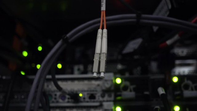 Fibre Channel fc switch on datacener server rack background. Video contains noise and vibration