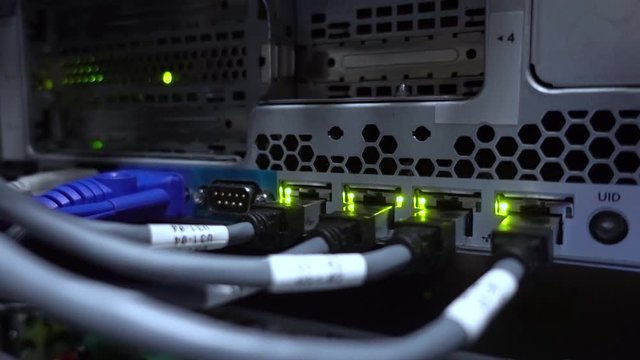 RJ45 cables plugged into switches. DataCenter Technology Concept.