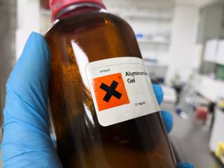 Dangerous and irritating chemical inside an amber bottle in a laboratory