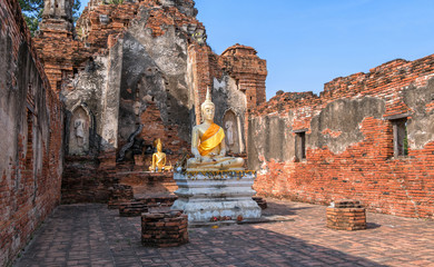 Majestic Buddha statues in an ancient Buddhist temple in Ayutthaya, Thailand