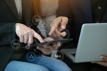 business woman hand on keyboard with application icons.