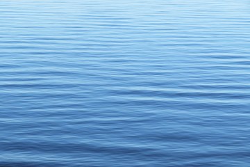 Smooth surface light blue water on Florida river, natural background 