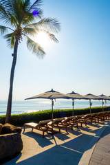 Umbrella and chair around outdoor swimming pool in hotel and resort