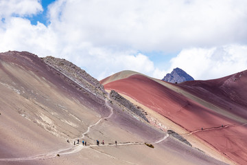 Fototapeta na wymiar People walk along the trail Rainbow Mountains Of Peru. Peruvian Andes.
