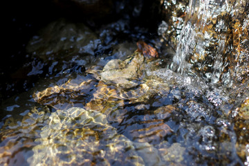 smooth clear water float on stone,rock water movement