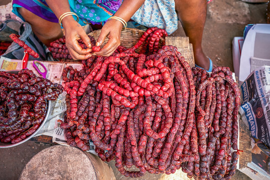 11/15/2019 India, Mapusa, GOA, Goa&rsquo;s pork sausages trading in the traditional grocery market. Goan sausage is a typical reflection of Indo-Portuguese cuisine. Spontaneous market concept