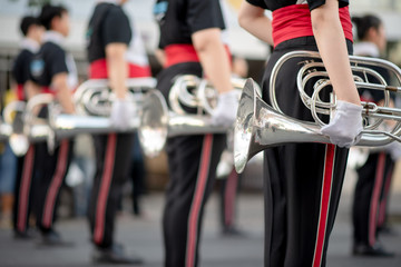 Close up and details of playing musicians, instruments in a marching, show band or music band