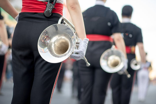 Close up and details of playing musicians, instruments in a marching, show band or music band