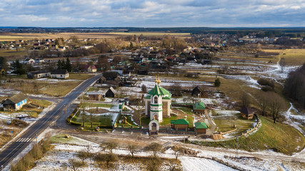 Orthodox church on cloudy sky background. Aerial view beautiful landscape..