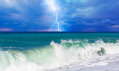 Lightning, blue clouds and sea 