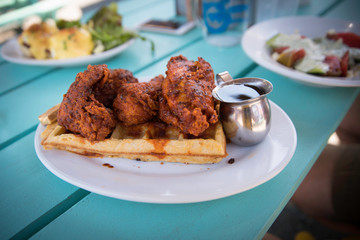 Close up of spicy chicken and waffle at brunch 